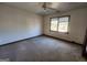 Simple bedroom with ceiling fan and carpeted floor at 1879 Wrights Way, Jonesboro, GA 30236