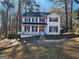 Two-story house with a red door and attached garage at 1879 Wrights Way, Jonesboro, GA 30236