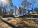 Two-story house with a red door and attached garage at 1879 Wrights Way, Jonesboro, GA 30236