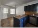 Kitchen with dark cabinets, tile flooring and stainless steel appliances at 1879 Wrights Way, Jonesboro, GA 30236
