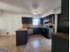 Kitchen with dark cabinets, tile flooring and stainless steel appliances at 1879 Wrights Way, Jonesboro, GA 30236