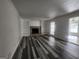Living room with fireplace, built-in shelves, and vinyl flooring at 1879 Wrights Way, Jonesboro, GA 30236