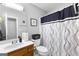 Simple bathroom with shower/tub and wood vanity at 3076 Carriage Trl, Jonesboro, GA 30236