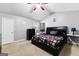 Bright bedroom with a king-size bed and ceiling fan at 3076 Carriage Trl, Jonesboro, GA 30236