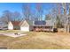 House exterior with stone and gray siding, solar panels and a deck at 3076 Carriage Trl, Jonesboro, GA 30236
