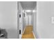 Long hallway with light walls and wood flooring at 3076 Carriage Trl, Jonesboro, GA 30236