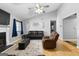 Relaxing living room with comfortable seating and a fireplace at 3076 Carriage Trl, Jonesboro, GA 30236