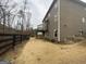 Spacious backyard of a charming two-story home with a beautiful wooden fence at 1320 Newbridge Cir, Buford, GA 30519