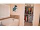 Bathroom featuring a large soaking tub and access to the walk in closet at 1320 Newbridge Cir, Buford, GA 30519