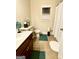 Functional bathroom featuring a single sink vanity, toilet, and shower with tasteful decor at 1320 Newbridge Cir, Buford, GA 30519