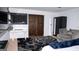 Bedroom features a sliding barn door, work station, a seating area, and an accent rug at 1320 Newbridge Cir, Buford, GA 30519