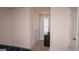 Bright, open bedroom with neutral walls, a window with blinds, and two doors, offering ample space at 1320 Newbridge Cir, Buford, GA 30519