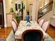 Charming dining room with seating for six, hardwood floors, and elegant decor creating a cozy atmosphere at 1320 Newbridge Cir, Buford, GA 30519