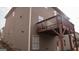 Side view of a two-story home featuring a private, covered wooden balcony at 1320 Newbridge Cir, Buford, GA 30519