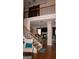 Open foyer with hardwood floors and view into the living room and second story at 1320 Newbridge Cir, Buford, GA 30519