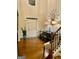 Warm and inviting foyer boasts hardwood floors, stylish accents, and plenty of natural light at 1320 Newbridge Cir, Buford, GA 30519