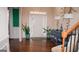 Bright foyer featuring hardwood floors, elegant decor, and a welcoming ambiance at 1320 Newbridge Cir, Buford, GA 30519