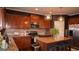 Open kitchen with stainless steel appliances, granite countertops, a center island with seating, and modern lighting fixtures at 1320 Newbridge Cir, Buford, GA 30519