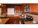 Beautiful kitchen featuring granite counters, stainless appliances, and ample cabinet space at 1320 Newbridge Cir, Buford, GA 30519