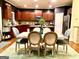 Eat-in kitchen featuring stainless appliances, granite counters, and a distressed wooden table with seating for six at 1320 Newbridge Cir, Buford, GA 30519