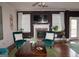 Comfortable living room featuring a fireplace, seating, and abundant natural light at 1320 Newbridge Cir, Buford, GA 30519