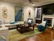 Relaxing living room with hardwood floors, a fireplace, and stylish furnishings at 1320 Newbridge Cir, Buford, GA 30519