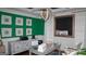 Bright office space with unique lighting, artwork, and functional storage solutions at 1320 Newbridge Cir, Buford, GA 30519