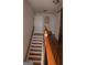 Traditional staircase with wooden rails and white steps, leading to the upper level of the house at 1320 Newbridge Cir, Buford, GA 30519
