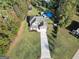 Aerial view of house with large yard and pool at 540 Deadwood Trl, Locust Grove, GA 30248