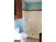 Clean bathroom with shower stall, toilet and vanity at 1760 Upland Ridge Nw Dr, Conyers, GA 30012