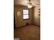 Cozy carpeted bedroom with natural light from window and closet with built-in shelves at 1760 Upland Ridge Nw Dr, Conyers, GA 30012