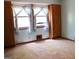 Bright carpeted bedroom with large windows and built-in storage, offering ample space and natural light at 1760 Upland Ridge Nw Dr, Conyers, GA 30012