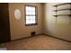 Inviting carpeted bedroom with natural light from window and closet with built-in shelves at 1760 Upland Ridge Nw Dr, Conyers, GA 30012