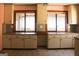 Kitchen with white cabinets and large windows at 1760 Upland Ridge Nw Dr, Conyers, GA 30012