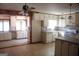 Kitchen with white cabinets, a gas stove, and an island at 1760 Upland Ridge Nw Dr, Conyers, GA 30012