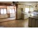 Kitchen boasts white cabinets and an eat-in area at 1760 Upland Ridge Nw Dr, Conyers, GA 30012