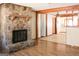 Living room featuring a stone fireplace and hardwood floors at 1760 Upland Ridge Nw Dr, Conyers, GA 30012