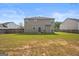 Spacious backyard with green grass and a wooden fence surrounding the property at 8264 Milam Loop, Fairburn, GA 30213