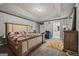Spacious bedroom featuring a stylish bed, neutral walls, and an ensuite bathroom at 8264 Milam Loop, Fairburn, GA 30213
