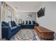 Cozy living room with plush sofas, decorative rug, and mounted TV at 8264 Milam Loop, Fairburn, GA 30213