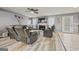 Living room featuring a fireplace, hardwood floors, and natural light at 8264 Milam Loop, Fairburn, GA 30213