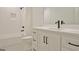 Modern bathroom with white vanity, bathtub, and black matte fixtures at 260 Cicely Way, Tyrone, GA 30290