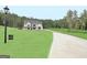 Modern farmhouse exterior with a long driveway at 260 Cicely Way, Tyrone, GA 30290