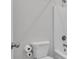 Bathroom with a toilet and a shower-tub combination, offering functionality and simplicity at 720 Lanarck Way, Peachtree City, GA 30269