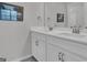 Bathroom featuring a double sink vanity with modern fixtures and ample counter space at 720 Lanarck Way, Peachtree City, GA 30269