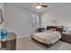 Inviting bedroom features neutral walls, a ceiling fan, and a comfortable bed at 720 Lanarck Way, Peachtree City, GA 30269