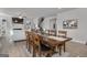 Dining room with seating for six, and views to the stairs, fireplace, and comfortable seating at 720 Lanarck Way, Peachtree City, GA 30269