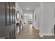 Welcoming entryway with wood flooring, a console table with decor, and views into the open-concept living spaces at 720 Lanarck Way, Peachtree City, GA 30269