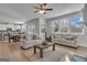Bright living room with hardwood floors and views to breakfast area that features modern, neutral decor at 720 Lanarck Way, Peachtree City, GA 30269