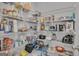 Walk-in pantry features adjustable wire shelving stocked with a variety of food items and small appliances at 720 Lanarck Way, Peachtree City, GA 30269